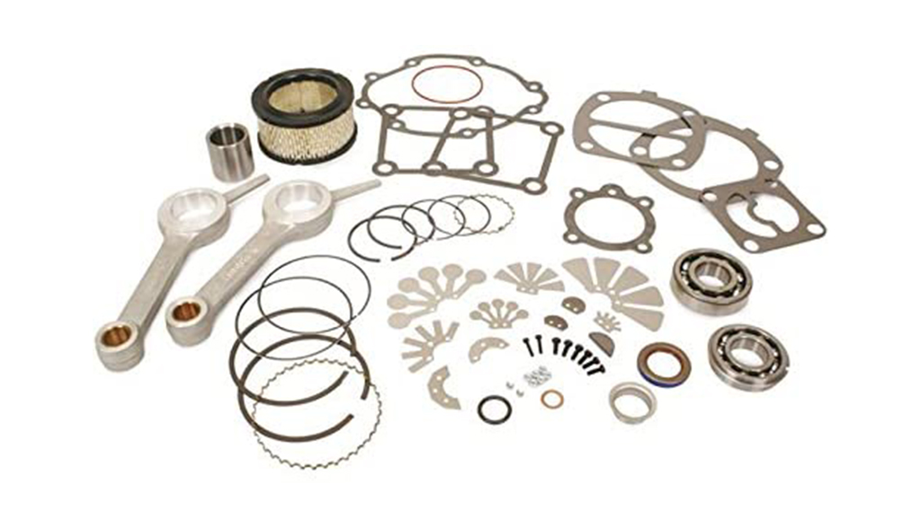 Various disassembled engine parts and components from Air Centers of Florida neatly laid out on a white background.