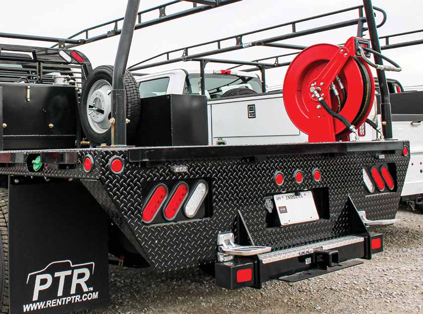 Rugged utility trailer equipped with a hose reel, storage compartments, and a black diamond plate finish, ready for heavy-duty work. Provided by Air Centers of Florida.
